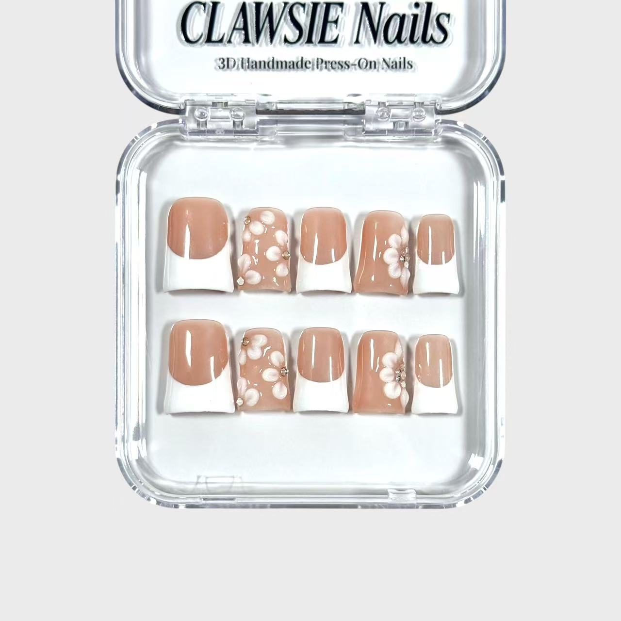 CLAWSIE 3D handmade press-on nails with white French tips, nude base and floral designs